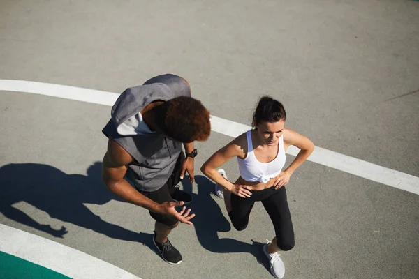 Directly View Confident African American Fitness Coach Counting Squats Trainee — Stock Photo, Image