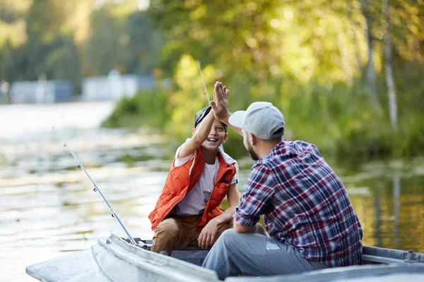Happy Son Giving High Five His Father Fishing Boat Lake — Stock Photo, Image