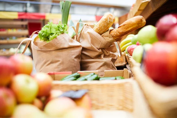 Close Shopping Bags Full Fresh Products Bread Vegetables Greens Counter — Stock Photo, Image