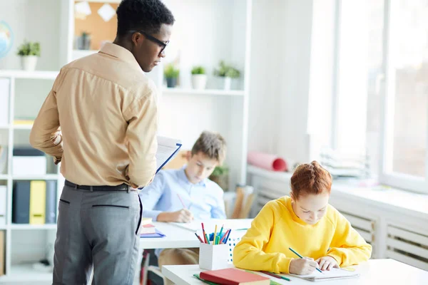 African American Young Man Moving Desks Lesson Looking Notes Diligent — Stock Photo, Image