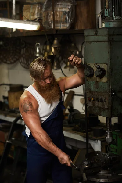 Serious Concentrated Muscular Craftsman Tattoo Long Beard Working Drilling Machine — Stock Photo, Image