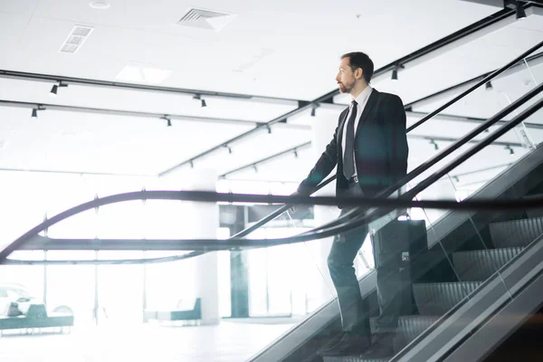 Young Confident Businessman Briefcase Standing Steps Escalator Moving Downwards — Stock Photo, Image