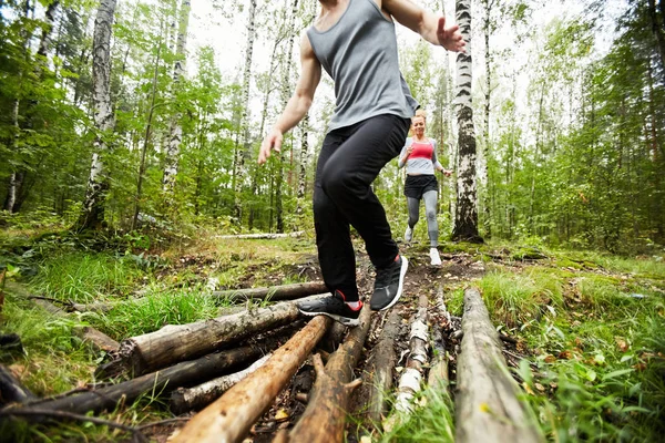 Young Active Man Woman Sportswear Moving Logs Forest Path While — 스톡 사진