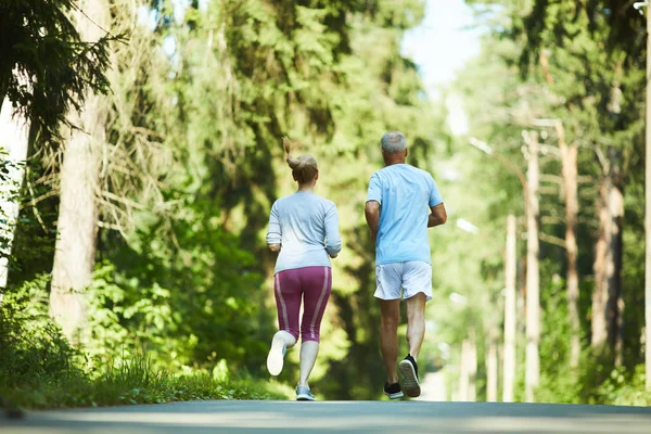 Back View Aged Spouses Activewear Running Road Park Trees Sunny — Stock Photo, Image