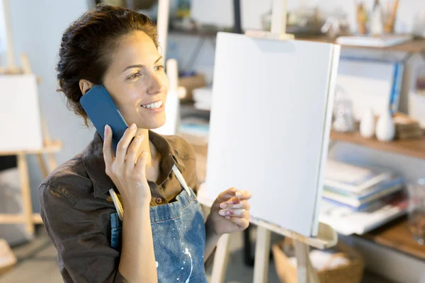 Happy Young Painter Talking Smartphone Workshop While Having Break — Stock Photo, Image