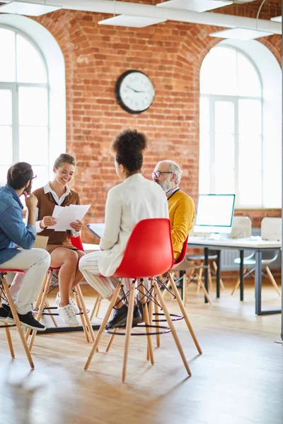 Four Adults Casualwear Discussing Data Briefing While Sitting Chairs Front — Stock Photo, Image