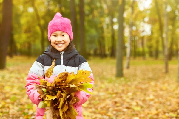 Happy Girl Toothy Smile Standing Center Large Park Heap Yellow — Stock Photo, Image