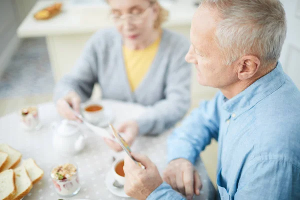 Senior Man Frey Hair His Wife Looking Pictures Breakfast — Stock Photo, Image