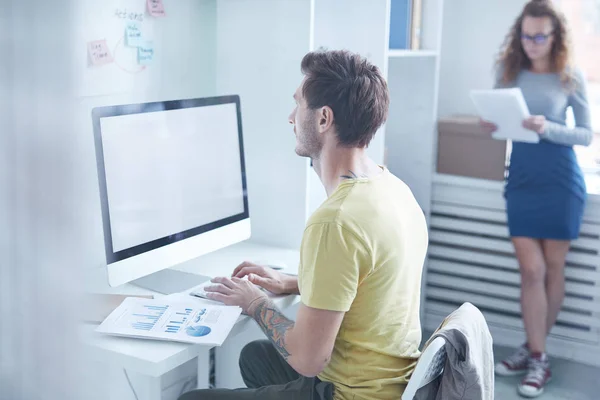 Young Designer Working Front Computer Monitor Desk His Colleague Reading — 스톡 사진