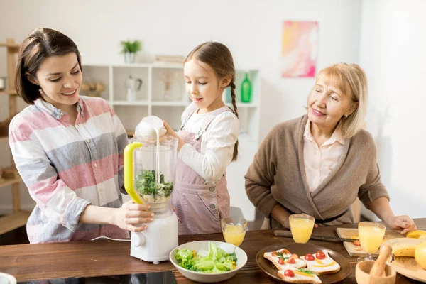 Adorale Girl Pouring Fresh Milk Electric Blender While Helping Her — Stock Photo, Image