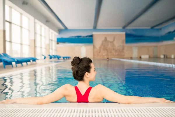 Back View Young Brunette Female Red Swimsuit Standing Water While — Stock Photo, Image