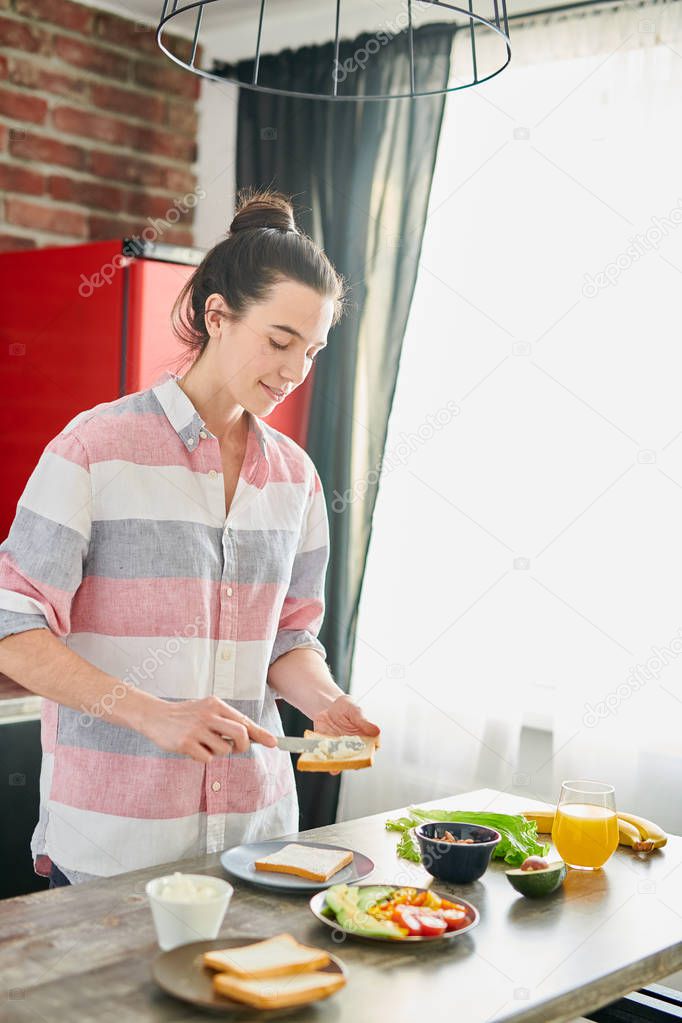 Young Woman Making Breakfast in Morning