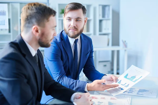 Young Confident Financier Suit Looking Colleague While Showing Him Paper — 스톡 사진