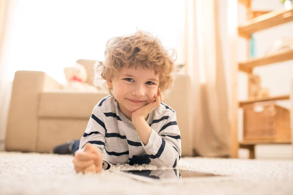 Adorable Little Boy Striped Casual Pullover Lying Floor Watching Online — Stock Photo, Image