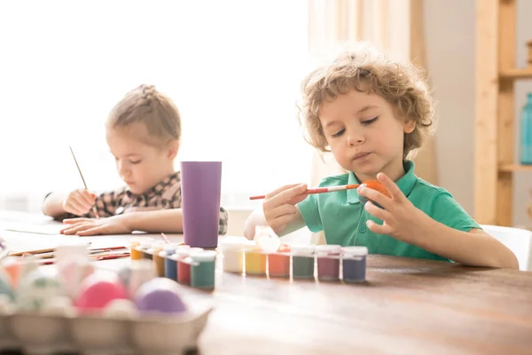 Adorable Boy Curly Hair Painting Eggs Gouache Table Background His — Stock Photo, Image