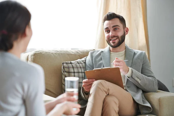 Young Confident Psychotherapist Sitting Comfortable Chair Asking His Patient Questions — Stock Photo, Image