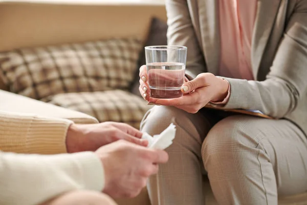 Young Female Counselor Grey Suit Holding Glass Water Patient While — Stock Photo, Image