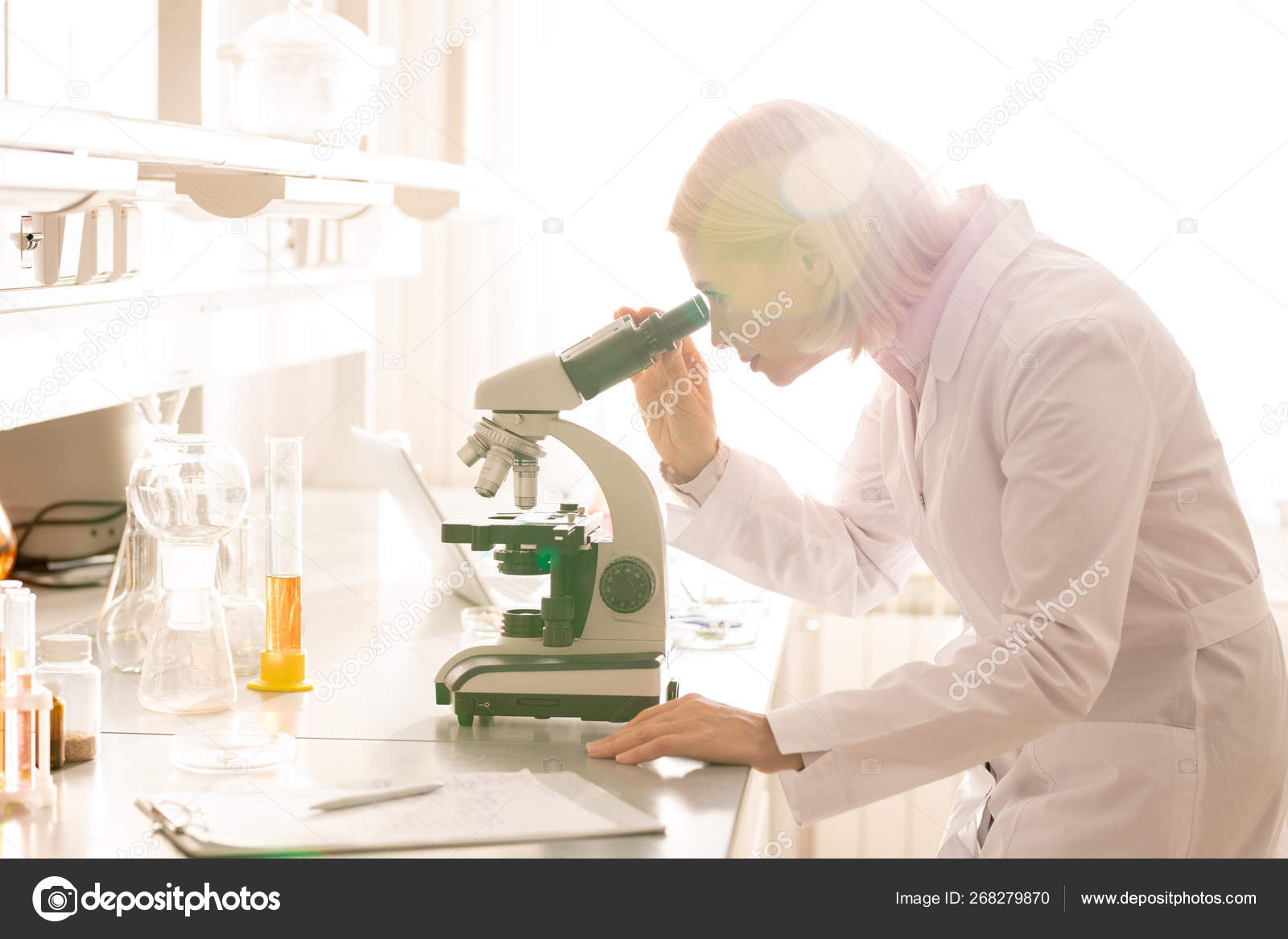 Serious Busy Mature Lady Blond Hair Standing Lab Bench Using