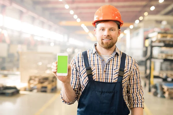 Young Successful Factory Engineer Overalls Helmet Showing Promo Touchscreen His — ストック写真