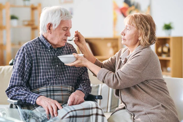 Aged Casual Woman Holding Bowl Soup Spoon Her Disable Husband — Stock Photo, Image