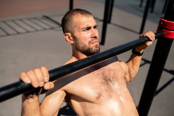 Young Shirtless Muscular Athlete Practicing Pull Ups While Holding Sports — Stock Photo, Image
