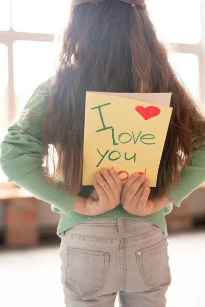 Rear View Long Haired Girl Sweater Jeans Standing Room Hiding — Stock Photo, Image