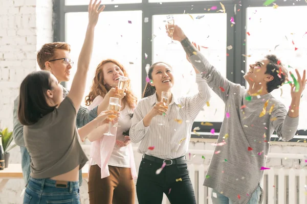 Group Young Ecstatic Friends Champagne Catching Confetti While Celebrating Life — Stock Photo, Image