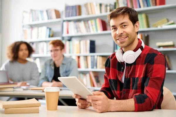 Young Successful Student Tablet Looking You While Sitting Desk Groupmates — Stock Photo, Image