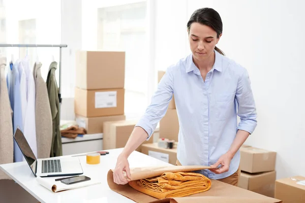 Young Manager Online Shop Wrapping Folded Yellow Trousers Paper While — Stock Photo, Image