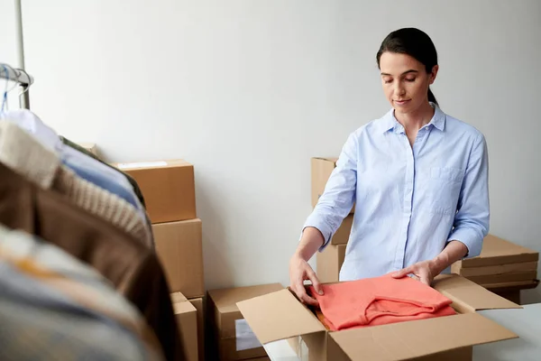 Young Casual Employee Putting Folded Casualwear Box Process Packing Client — Stock Photo, Image