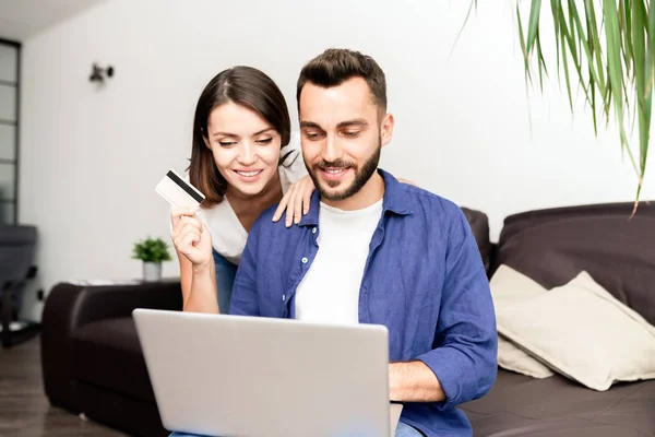 Cheerful Modern Young Couple Casual Clothing Sitting Sofa Using Laptop — Stock Photo, Image