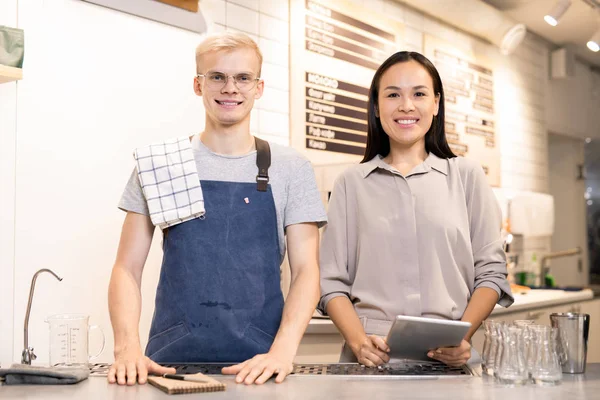Young Cheerful Friendly Workers Cafe Toothy Smiles Standing Counter While — Stock Photo, Image