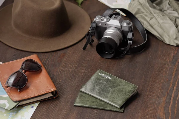 Close Tourists Stuff Passports Covers Photographic Camera Hat Eyeglasses Dark — Stock Photo, Image