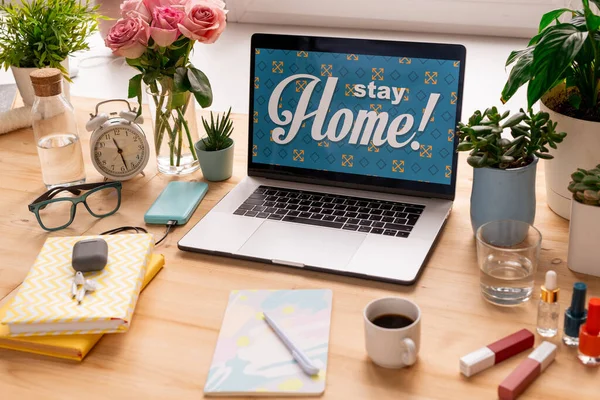 Desktop Stay Home Display Laptop Surrounded Flowers Alarm Clock Books — Stock Photo, Image