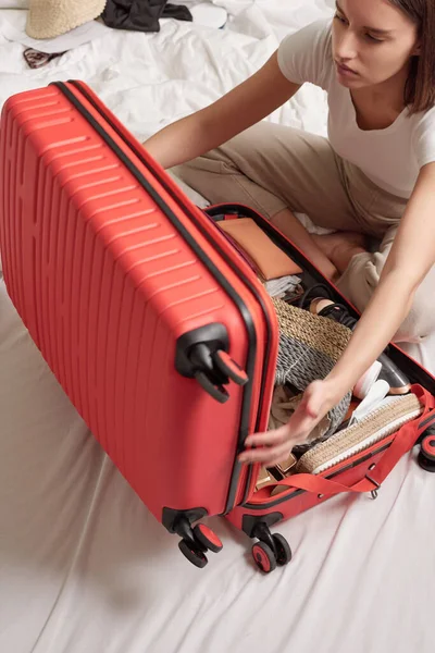 Young Woman Sitting Bed Closing Suitcase Full Clothes While Preparing — Stock Photo, Image