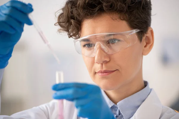 Close Focused Chemist Protective Goggles Dropping Reagent While Examining Chemical — Stock Photo, Image