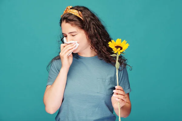 Sick Young Woman Handkerchief Blowing Her Nose While Holding Sunflower — Stock Photo, Image