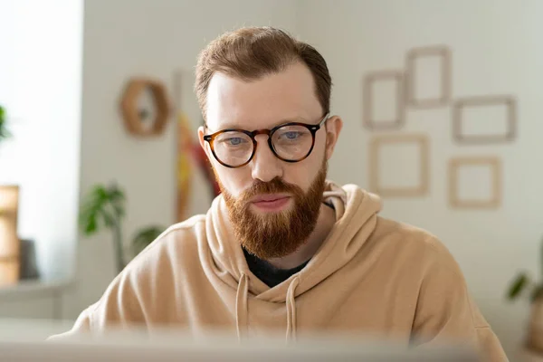 Busy Young Bearded Programmer Glasses Working Laptop While Analyzing Pictures — Stock Photo, Image