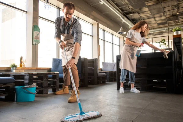 Busy Young Couple Aprons Doing Cleaning Cafe While Preparing Opening — Stock Photo, Image