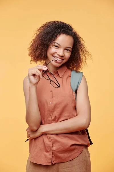 Portrait Positive Black Girl Curly Hair Holding Eyeglasses Bright Background — Stock Photo, Image