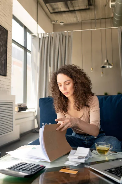 Focused Curly Haired Young Woman Immersed Social Media Typing Laptop — Stock Photo, Image