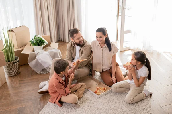 View Happy Young Family Two Children Sitting Floor Enjoying First — Stock Photo, Image