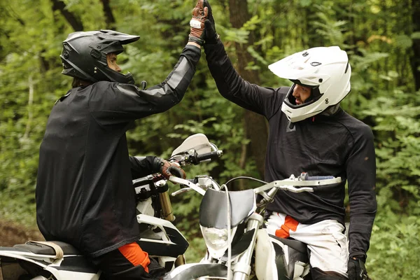 Young Men Helmets Sitting Motorbikes Giving High Five While Supporting — Stock Photo, Image