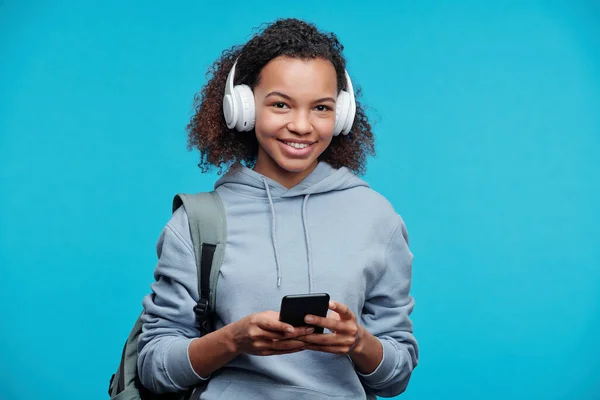 Portrait Cheerful Black Girl Wireless Headphones Choosing Track Smartphone While — Stock Photo, Image