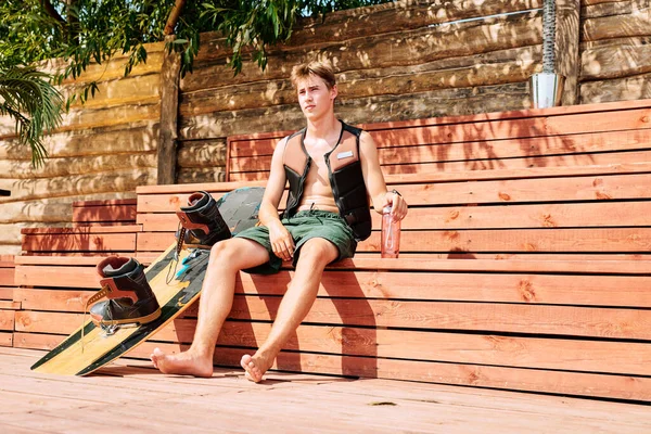 Young Male Surfer Shorts Safety Jacket Having Water While Sitting — Stock Photo, Image