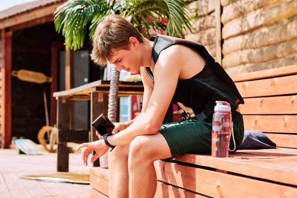 Young Contemporary Sportsman Shorts Safety Jacket Sitting Wooden Bench Break — Stock Photo, Image