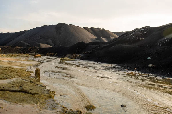 Abandoned Unusable Territory Dirty Water River Polluted Soil Surrounded Hills — Stock Photo, Image