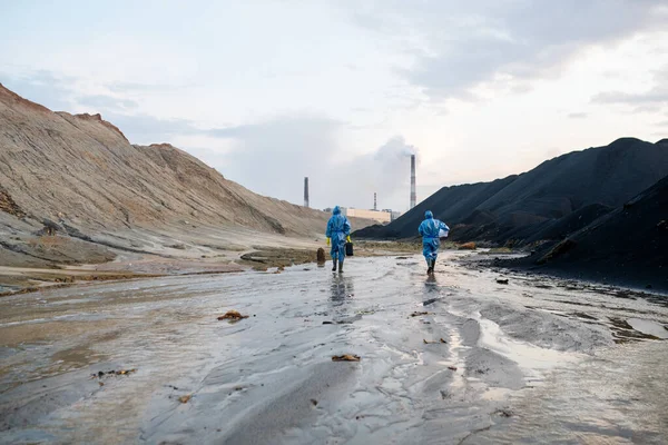 Rear View Two Female Scientists Blue Protective Coveralls Moving Road — Stock Photo, Image