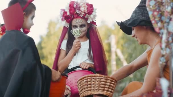 Medium Shot Young Woman Witch Hat Giving Candy Children Halloween — Stock Video