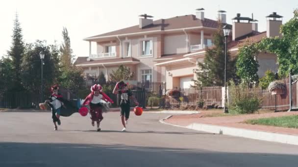 Slowmo Shot Children Halloween Costumes Carrying Baskets Bag Trick Treating — Stock Video